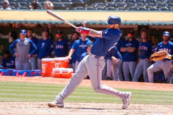 Rangers score 10 in second to roll past A’s