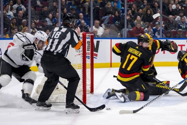 Kings slow Canucks’ division push with narrow win